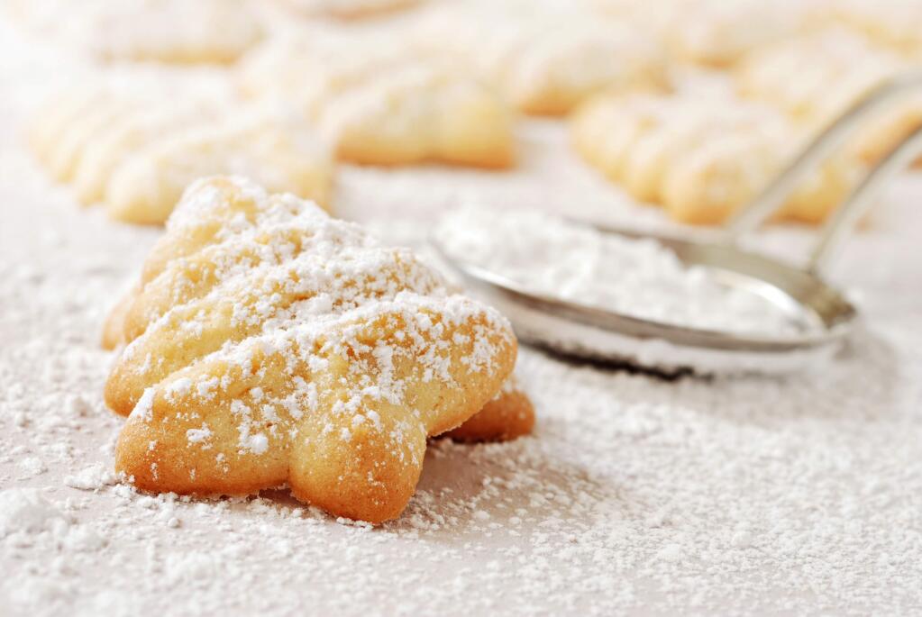 A sprinkle of powdered sugar finishes off Polly Ann Bakery's traditional Danish butter cookies.
