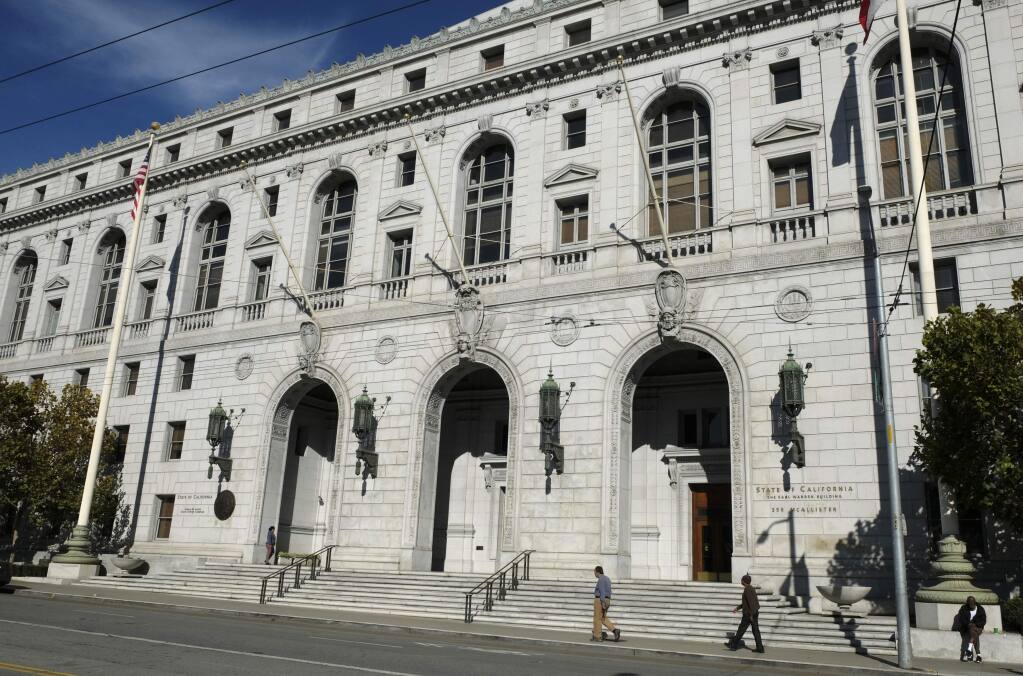 In this Nov. 2, 2018, file photo, people walk past the Earl Warren Building that houses the California Supreme Court in San Francisco. (AP Photo/Eric Risberg, File)