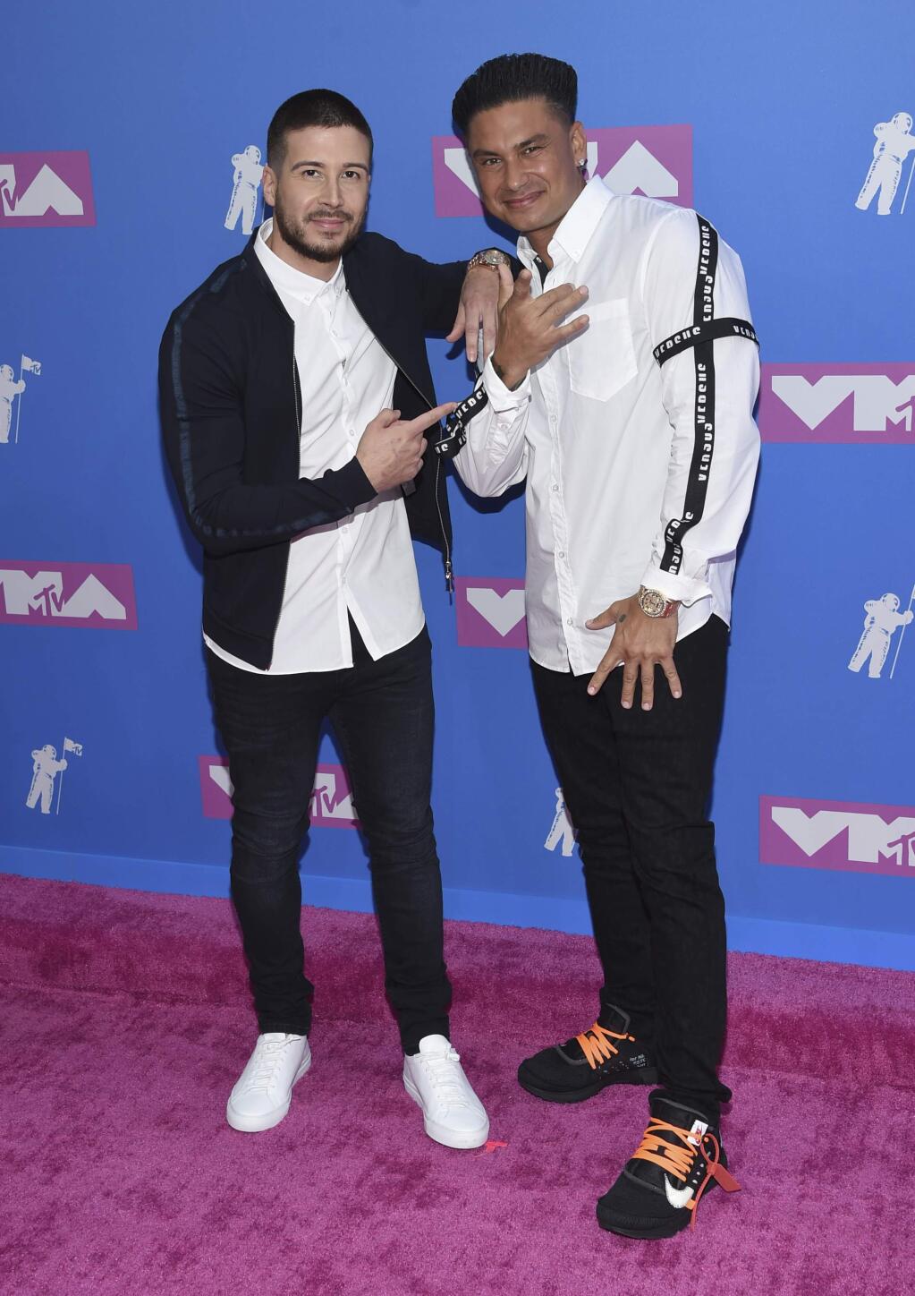 Vinny Guadagnino, left, and Paul 'DJ Pauly D' DelVecchio arrive at the MTV Video Music Awards at Radio City Music Hall on Monday, Aug. 20, 2018, in New York. (Photo by Evan Agostini/Invision/AP)