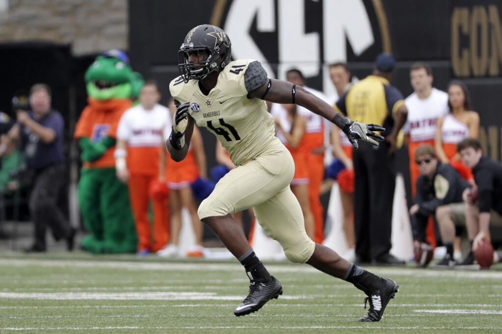 FILE --In this Oct. 1, 2016, file photo, Vanderbilt linebacker Zach Cunningham plays against Florida in an NCAA college football game in Nashville, Tenn. Cunningham is making his case for Southeastern Conference defensive player of the year with one remarkable play after another. The Vanderbilt linebacker made the game-saving stop on fourth-and-1 last month and hurdled the line to block a field goal last week at Auburn. (AP Photo/Mark Humphrey, File)
