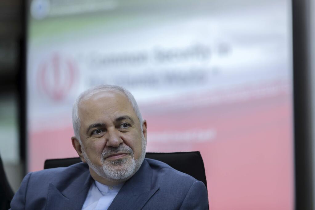 FILE - In this Aug. 29, 2019 file photo, Iranian Foreign Minister Mohammad Javad Zarif attends a forum titled 'Common Security in the Islamic World' in Kuala Lumpur, Malaysia. In an interview published by CNN Thursday, Sept. 19, 2019, Zarif warned that any U.S. or Saudi military strike on Iran will result in 'all-out war.' It comes after U.S. Secretary of State Mike Pompeo called an attack on Saudi oil installations an 'act of war.' (AP Photo/Vincent Thian, File)