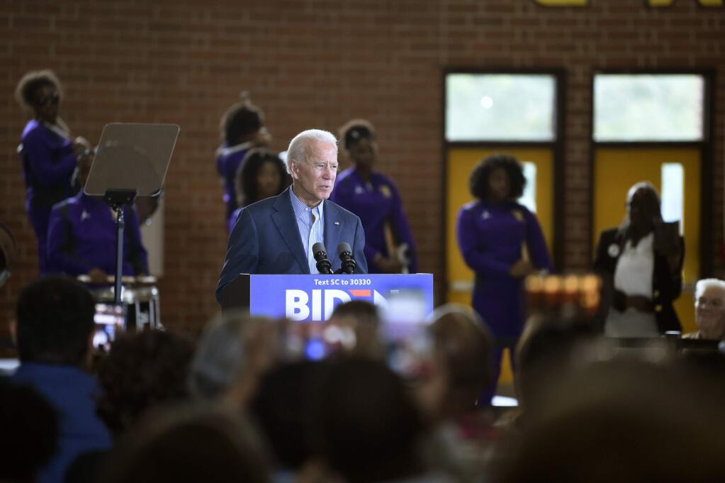 FILE - In this Oct. 26, 2019 file photo Democratic presidential candidate, former vice president Joe Biden speaks at a town hall in Florence, S.C. A Catholic priest in South Carolina denied communion to Joe Biden over the weekend, a decision purportedly made over the former vice president's stance on abortion. It illustrates the tricky challenge facing presidential candidates as they share their faith on the trail: How to balance the private and deeply personal values of their religions with a public campaign schedule that pushes them to authentically choose a side in polarizing moral debates? (AP Photo/Meg Kinnard, File)