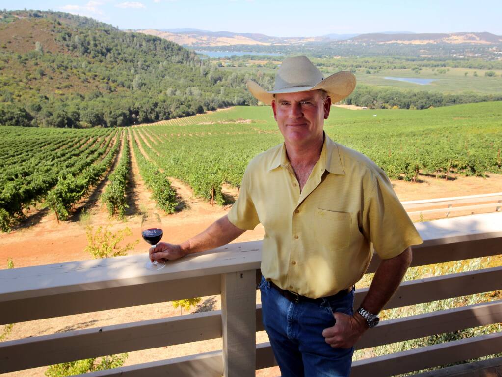Clay Shannon, seen here at his Lake County winery tasting room, saw his commercial property insurance premiums more than double because of the massive North Bay wildfires in the past several years. (Crista Jeremiason / The Press Democrat) 2013
