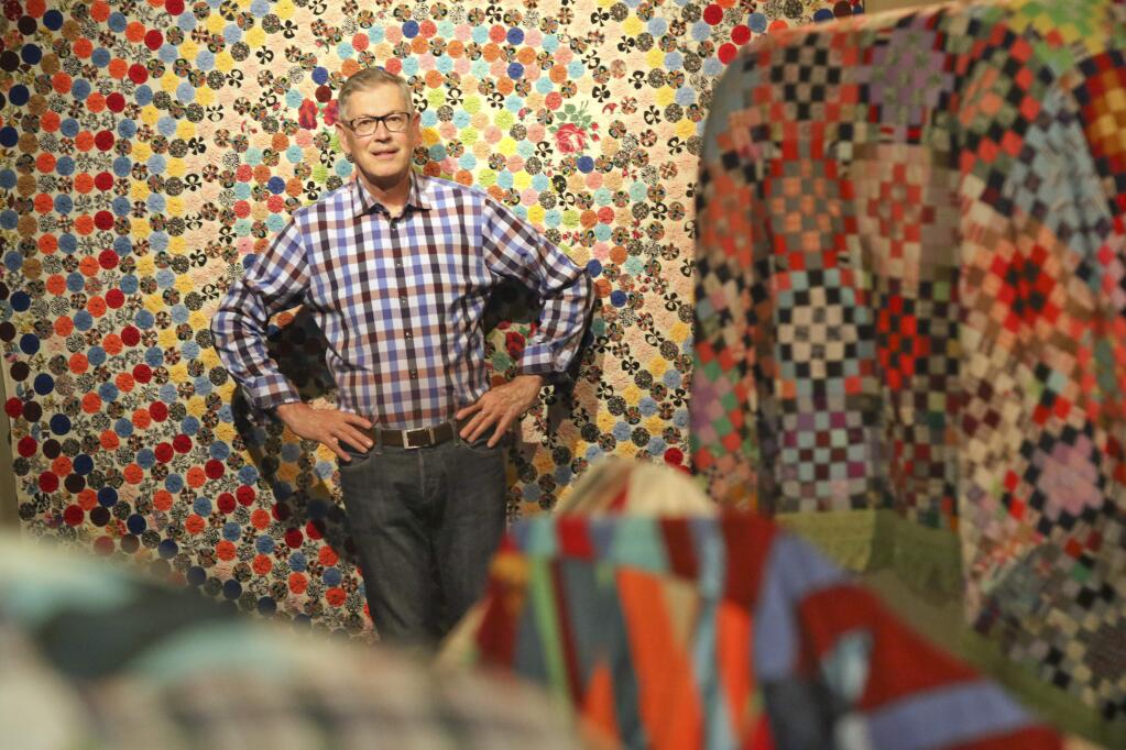 Quilt historian and collector Roderick Kiracofe of Petalaluma with some of his quilts on display at the Sonoma Valley Museum of Art in Sonoma on Tuesday April 28, 2015. (SCOTT MANCHESTER/ARGUS-COURIER STAFF)
