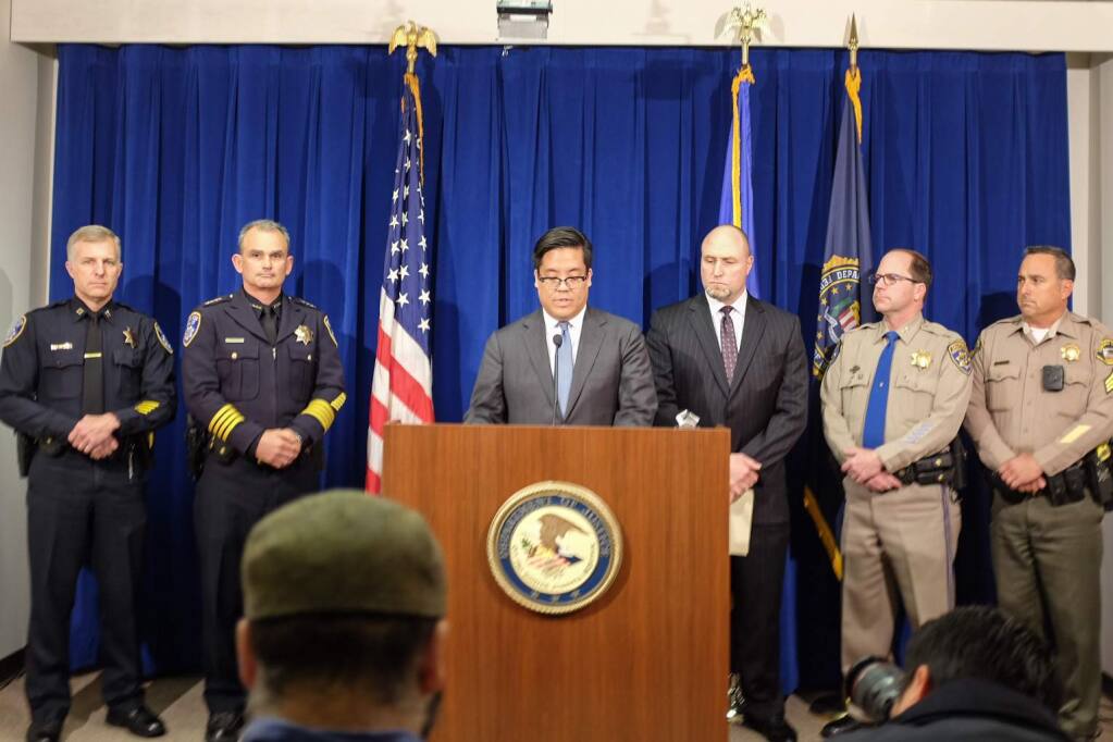 First U.S. Assistant Attorney Alex Tse announces indictments Monday, Nov. 20, 2017, of eight alleged Sonoma County Hells Angels. Behind him during the announcement at the San Francisco Federal Building are, left-to-right, Santa Rosa Police Capt. Craig Schwartz, Santa Rosa Police Chief Hank Schreeder, FBI Special Agent John Bennett, CHP Golden Gate Division Chief Paul Fontana and Sonoma County Sheriff Sgt. Spencer Crum. (NICK RAHAIM / Press Democrat)