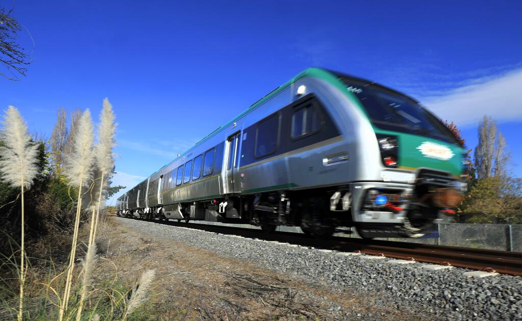 A SMART train passes through Rohnert Park at Southwest Blvd. on Friday. (John Burgess/The Press Democrat)