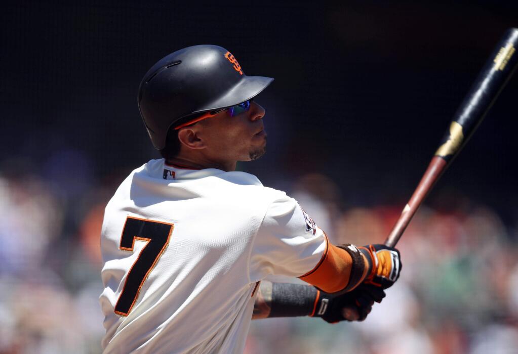 San Francisco Giants' Gorkys Hernandez swings for a two-run double off Chicago Cubs' Mike Montgomery in the first inning of a baseball game Wednesday, July 11, 2018, in San Francisco. (AP Photo/Ben Margot)