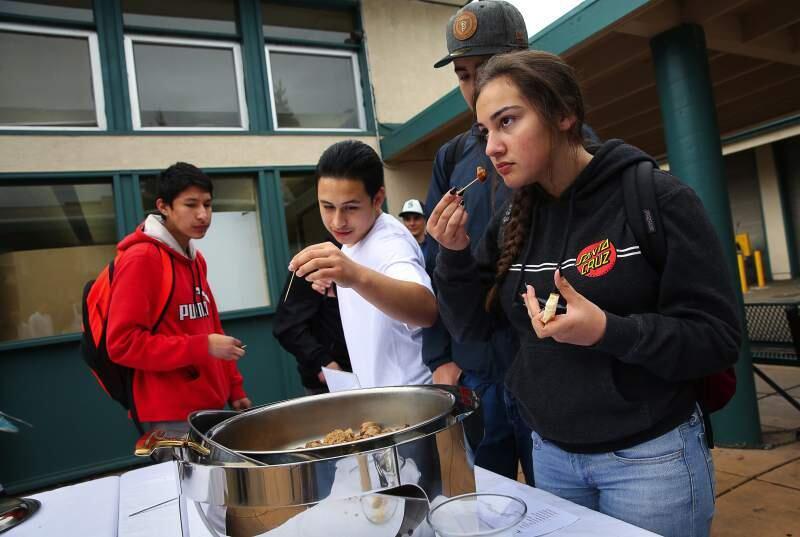 Slaves to the grinder: Students sample a sausage last week at the Porkfolio tasting at Sonoma Valley High School.
