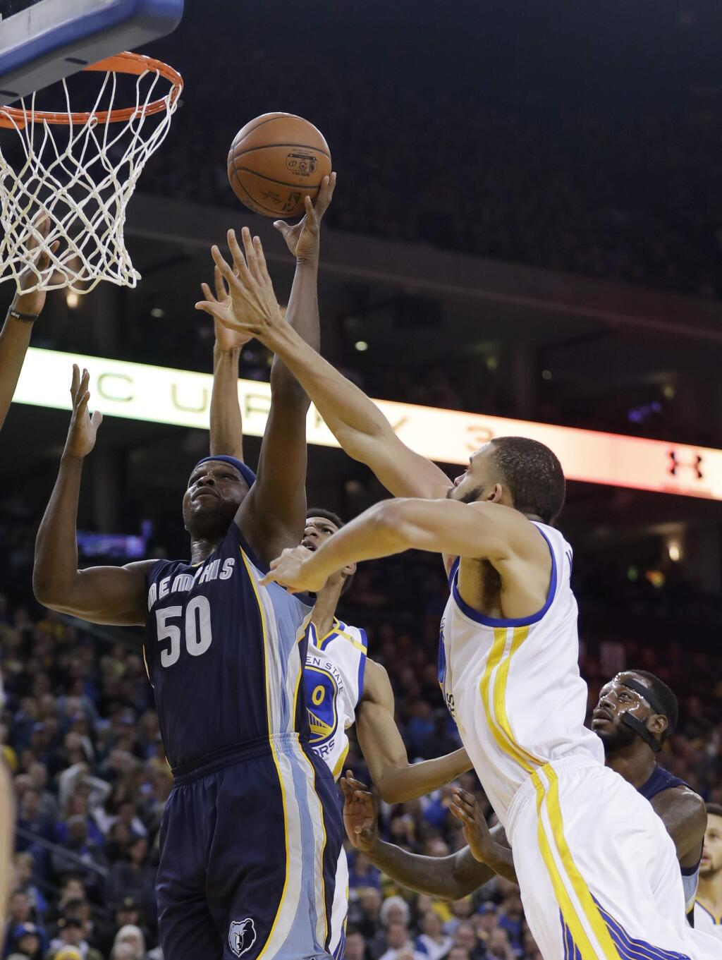 Memphis Grizzlies' Zach Randolph (50) shoots as Golden State Warriors' JaVale McGee, right, closes in during the first half of an NBA basketball game Friday, Jan. 6, 2017, in Oakland, Calif. (AP Photo/Marcio Jose Sanchez)