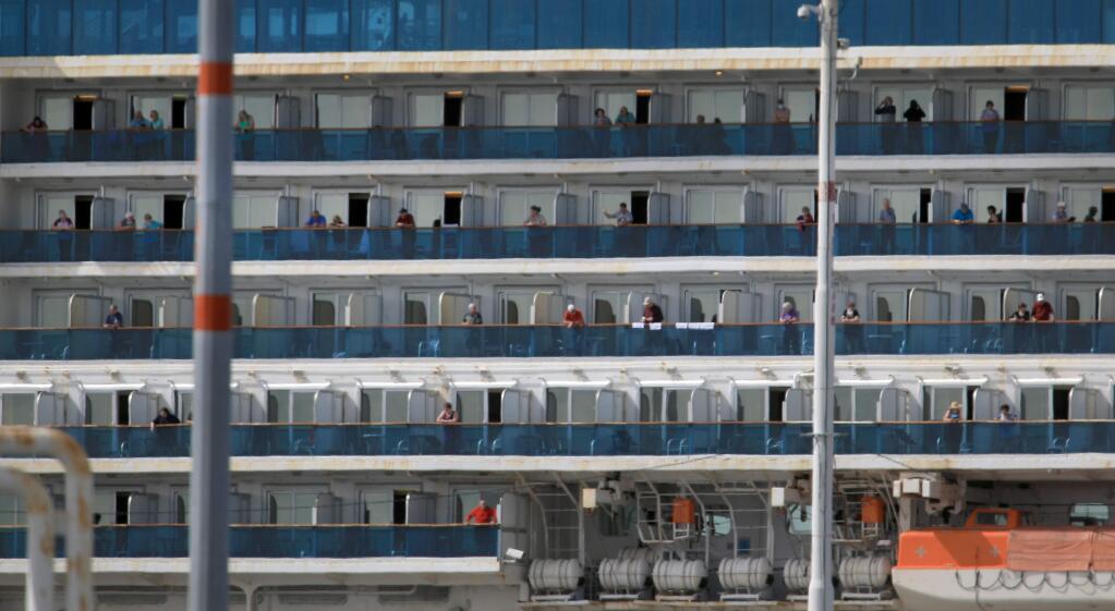Passengers of the Grand Princess watch the dock activity at the Port of Oakland, Monday, March 9, 2020 after the cruise ship was a docked. (Kent Porter / The Press Democrat) 2020