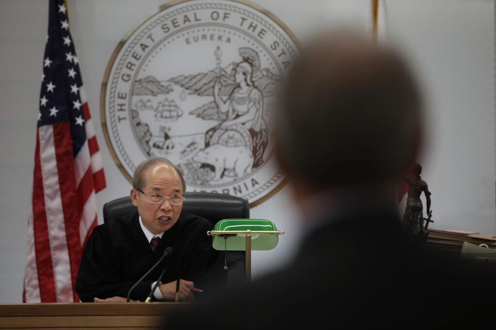 In this Thursday, April 23, 2015 photo, Judge Nho Trong Nguyen presides over a hearing in a courtroom in San Bernardino, Calif. Nguyen, now 77, said he still misses life in Vietnam - the rice fields where he lived until his farming family was pushed south by the communists; his father to work as a mason, his mother, as a street vendor. (AP Photo/Jae C. Hong)