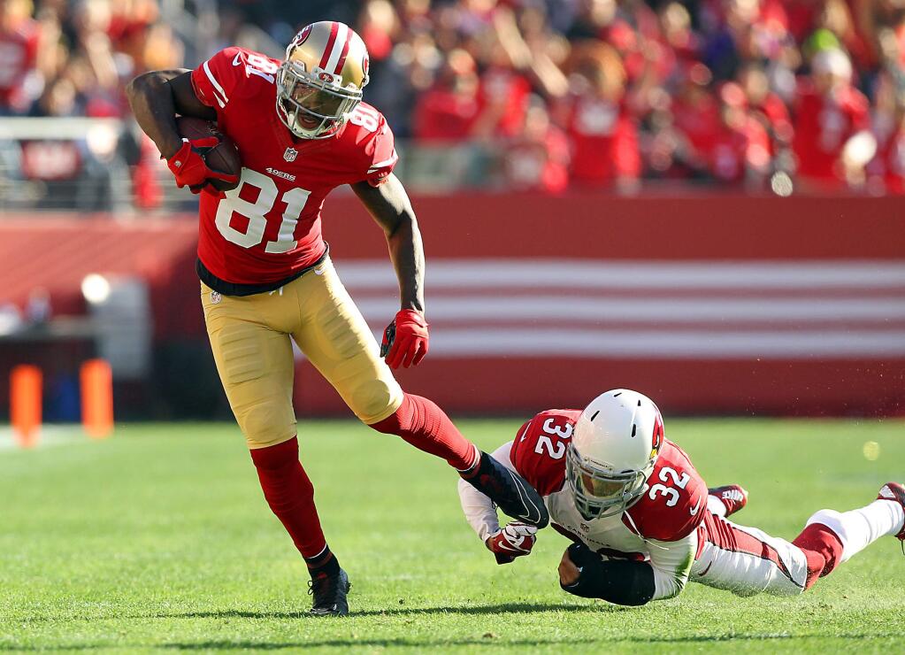 San Francisco 49ers' Anquan Boldin breaks the tackle of Arizona Cardinals' Tyrann Mathieu during a 2014 NFL game. (JOHN BURGESS/ PD FILE)