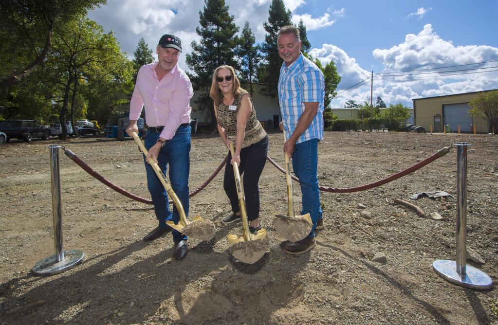 From left, Henry Wix, architect; Nancy King, executive director Pets Lifeline; and Scott Miller, contractor, all turn the soil with golden shovels at the official groundbreaking ceremony for the new Pets Lifeline facility on Wednesday, Sept. 18. (Photo by Robbi Pengelly/Index-Tribune)