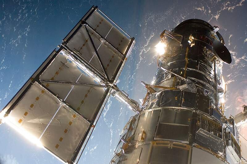 The Hubble Space Telescope in a picture snapped by a Servicing Mission 4 crewmember just after the Space Shuttle Atlantis captured Hubble with its robotic arm on May 13, 2009, beginning the mission to upgrade and repair the telescope. (NASA / HUBBLESITE.ORG)