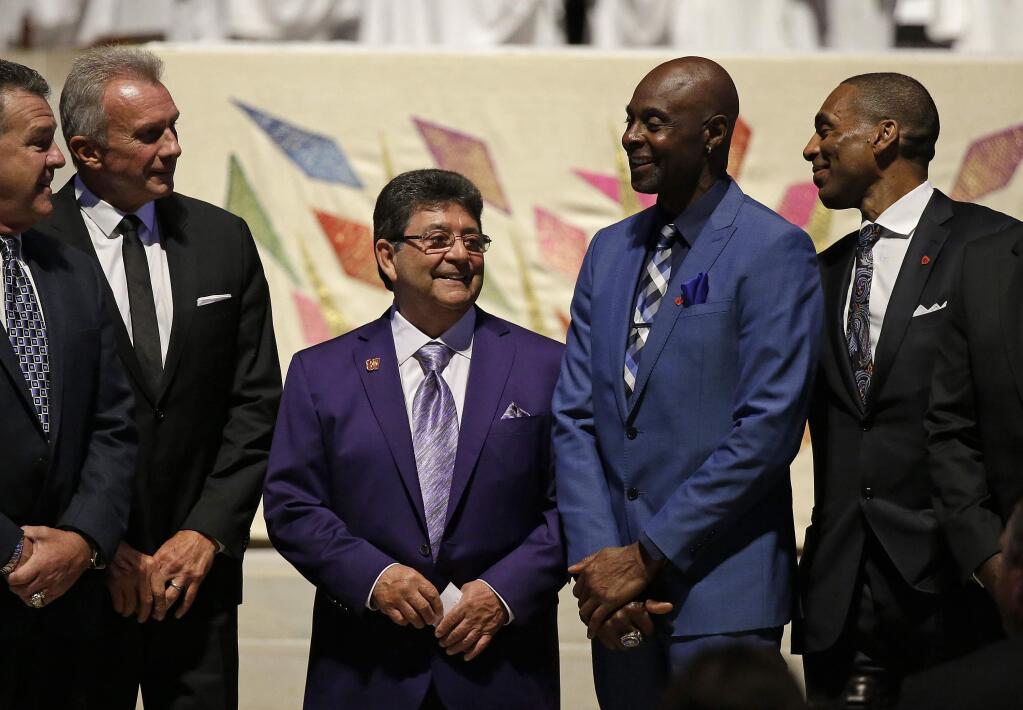 From left, Joe Montana, Edward J. DeBartolo Jr., Jerry Rice and Roger Craig stand together during a memorial service at Grace Cathedral for San Francisco 49ers great Dwight Clark, Wednesday, Aug. 1, 2018, in San Francisco. Clark, who died of ALS on June 4, is known for making 'The Catch' that sent the 49ers to Super Bowl XVI in 1982. (AP Photo/Eric Risberg)