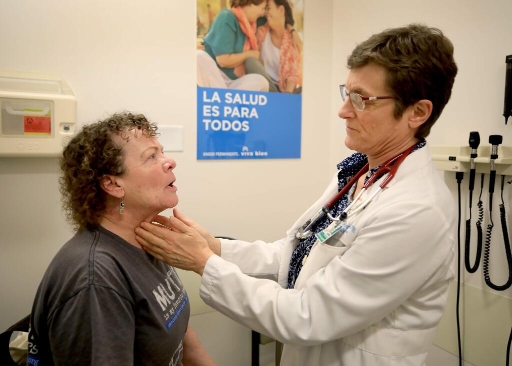 Kaiser family physician Dr. Kate Feibusch, Wednesday, Feb. 19, 2020 examines Susan Aguilera of Cloverdale at Kaiser Hospital in Santa Rosa. Feibusch, leads a nonprofit organization in Guatemala called Peten Health that trains community health workers and will be traveling to that country to celebrate the opening of a new clinic and training center. (Kent Porter / The Press Democrat) 2020