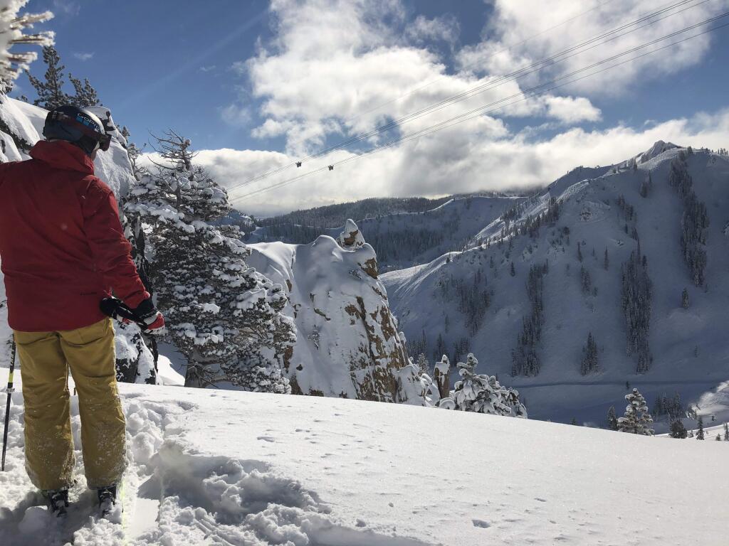 A skier overlooks a snowy valley on Monday, Feb. 18. (Photo courtesy | Squaw Valley Alpine Meadows)