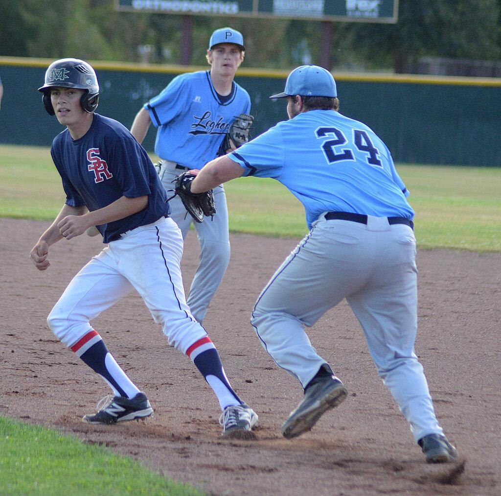 SUMNER FOWLER/FOR THE ARGUS-COURIERMaclean Meyn and the Petaluma Leghorns American Legion baseball team start trying to run down the Area championship on July 22 in Woodland. Behind is Leghorn second baseman Logan Douglas.
