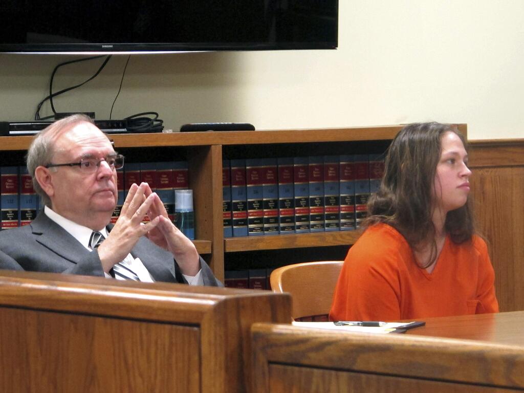FILE - In this Aug. 20, 2015, file photo, Brittany Pilkington, right, and her attorney Marc Triplett, left, listen as a judge sets a $1 million bond in her case during a hearing in Bellefontaine, Ohio. An Ohio judge is reviewing recorded police interviews of Pilkington, a woman accused of suffocating her three young sons, as he considers her lawyers' request to exclude her confession. Her trial is scheduled for late February. (AP Photo/Andrew Welsh-Huggins, File)