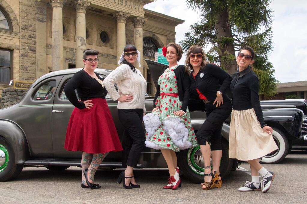 Left to right are 'Sugar Placebo,' Kitty Juju,' 'Rae Diamond,' 'Mustang Michelle,' and 'Spitfire Fox,' of the Sonoma County Calendar Girls, who work with local non-profits to raise awareness and funding for various causes, at the 11th Annual Petaluma's Salute to American Graffiti Celebration in downtown Petaluma on Saturday, May 21, 2016. (ASHLEY COLLINGWOOD/FOR THE ARGUS-COURIER)