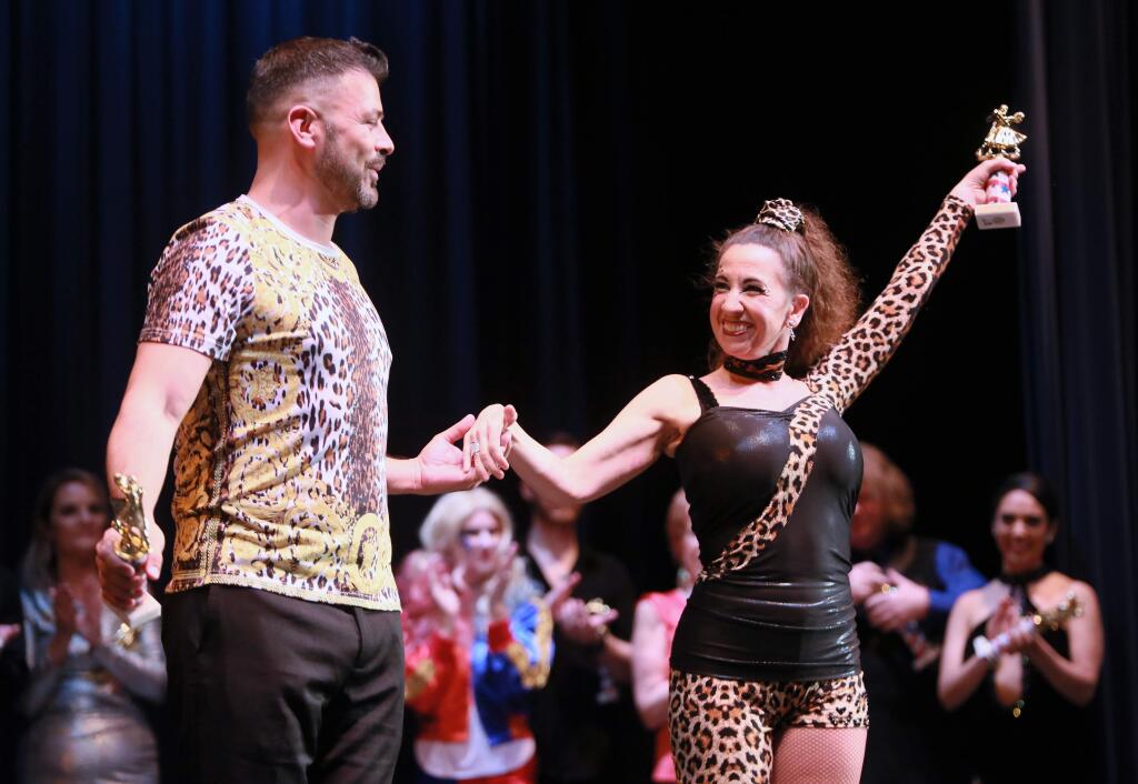 Mike Henderson and Jenifer Goss celebrate winning Best Overall Score Grand Prize Winner at the Dancing with the Stars and Stripes, a benefit for the Veterans Resource Centers of America at the Jackson Theater, Sonoma Country Day School in Santa Rosa, April 13, 2019. (WILL BUCQUOY/ For the PD)