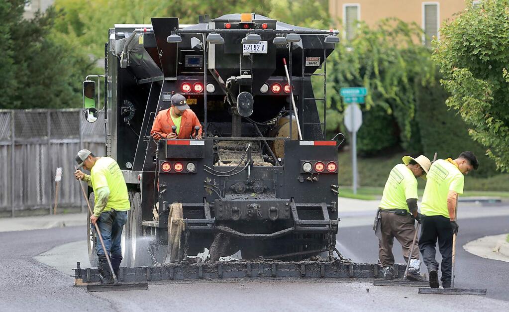 File -- Sections of road will be slurry sealed July 26 through Aug. 6 in order to maintain pavement surfaces, Santa Rosa officials announced Monday. New street markings will be added to street surfaces once slurry seal work has concluded.(Kent Porter / Press Democrat)