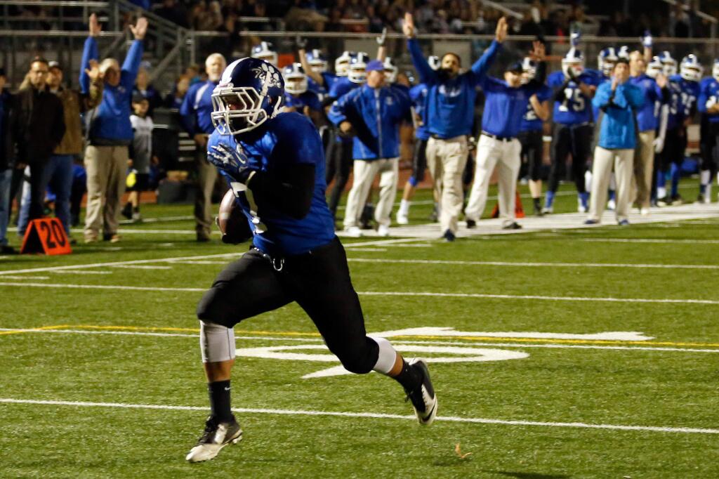 Analy running back Osiris Zamora (7) finds a large opening to run in for a touchdown during the first half of the NCS Division 3 quarterfinal between Analy and El Cerrito high schools, in Santa Rosa on Friday, Nov. 20, 2015. (Alvin Jornada / The Press Democrat)