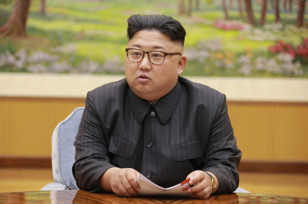 FILE- In this Sept. 3, 2017, image distributed on Sept. 4, 2017, by the North Korean government, North Korea's leader Kim Jong Un holds a meeting of the ruling party's presidium. Kim is calling President Donald Trump 'deranged' and says in a statement carried by the state news agency that he will 'pay dearly' for his threats. The statement, carried by North's official Korean Central News Agency, responds to Trump's combative speech at the U.N. General Assembly on Tuesday, Sept. 19. (Korean Central News Agency/Korea News Service via AP, File)