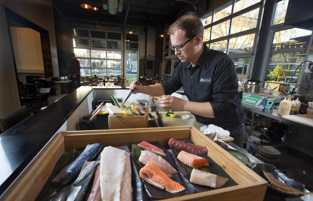 Sushi Kosho chef/owner Jake Rand prepares a Chef's Choice Seasonal Sashimi at the restaurant in Sebastopol's Barlow. (photo by John Burgess/The Press Democrat)