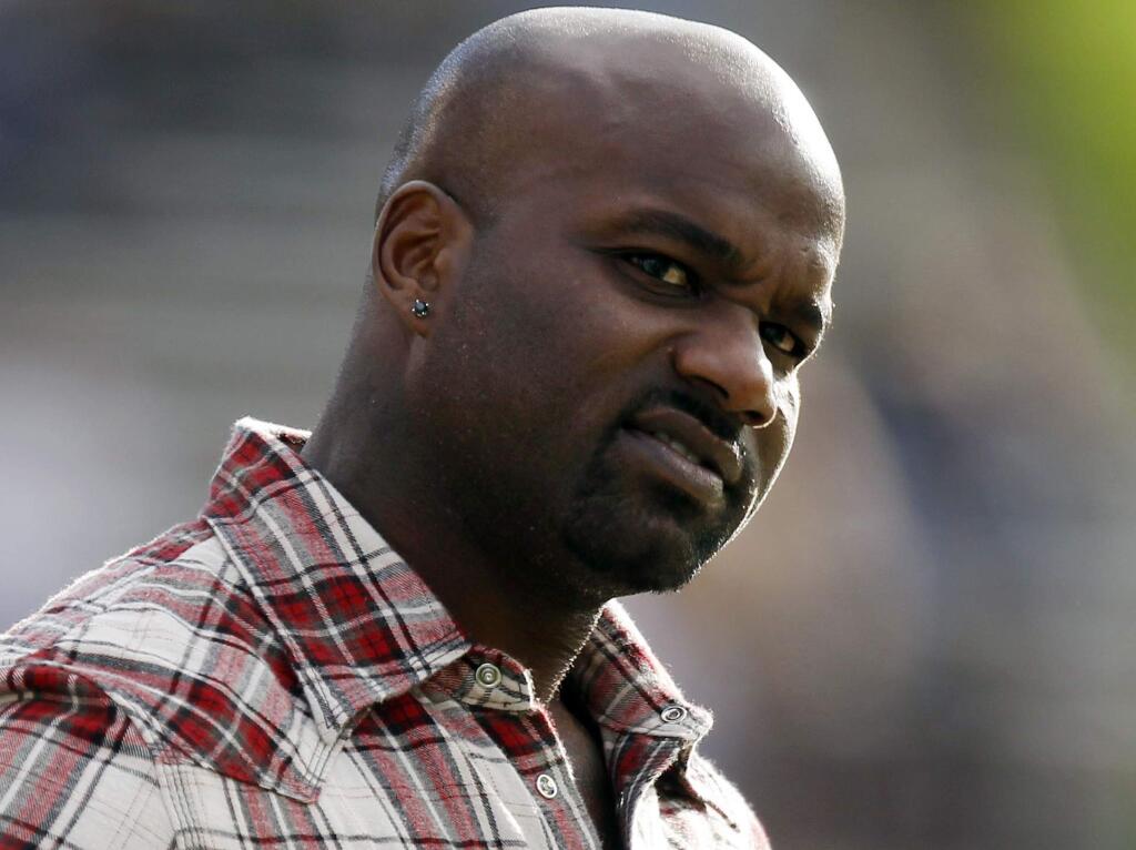 FILE - In this Nov. 7, 2012, file photo, former Colorado running back and Heisman Trophy winner Rashaan Salaam watches from the sidelines during the third quarter of an NCAA college football game between Colorado and Washinnton, in Boulder, Colo. Authorities say 1994 Heisman winner Rashaan Salaam has been found dead in a park in Boulder. The Boulder County coroner's office said Tuesday, Dec. 6, 2016, that it is still investigating the death of 42-year-old Salaam. (AP Photo/David Zalubowski, File)