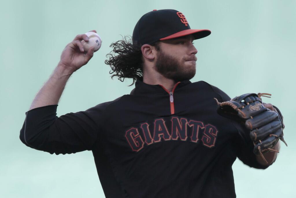 Giants short stop Brandon Crawford fields a ground ball during a workout a day before Game 1 of the World Series at Kauffman Stadium on Monday, October 20, 2014 near Kansas City, Missouri. (BETH SCHLANKER/ The Press Democrat)