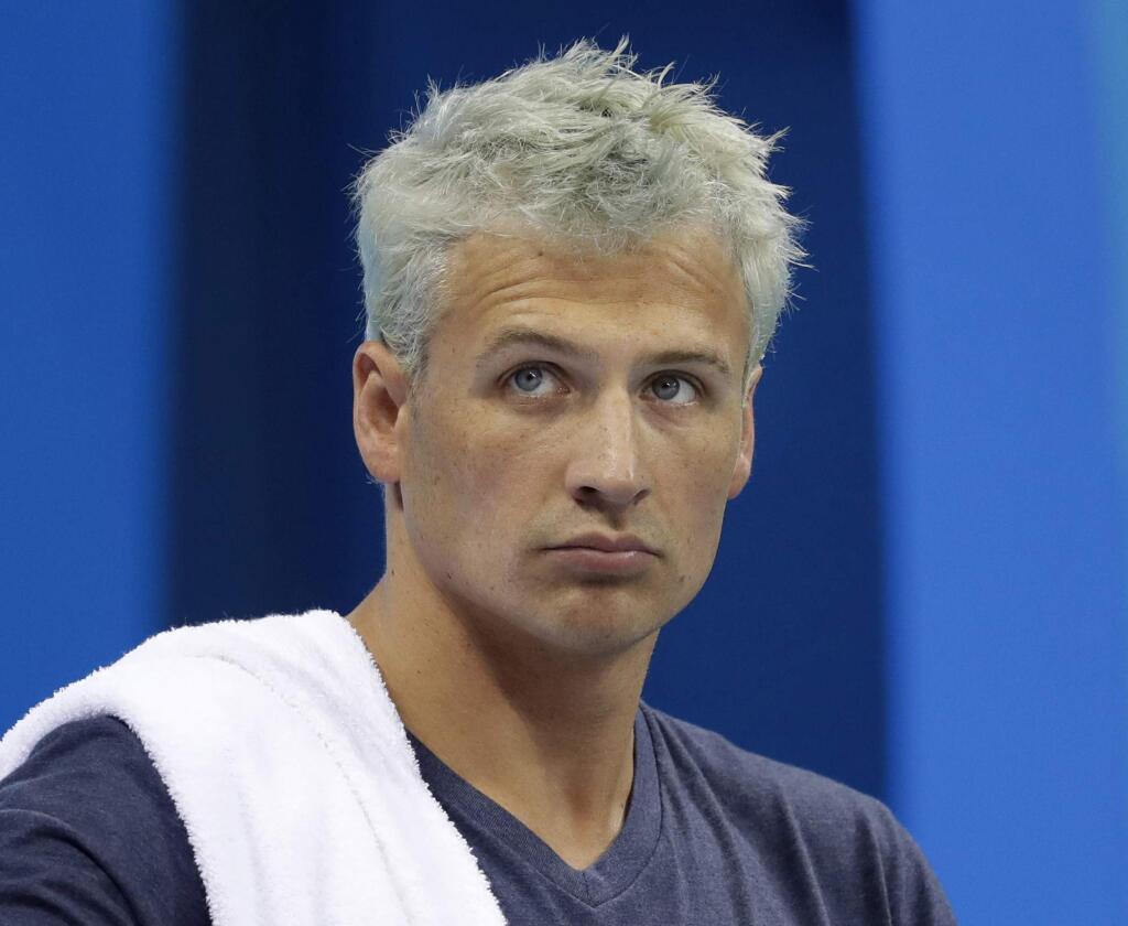 FILE - In this Aug. 9, 2016, file photo, United States' Ryan Lochte prepares before a men's 4x200-meter freestyle heat at the 2016 Summer Olympics, in Rio de Janeiro, Brazil. Lochte says he feels 'a little hurt' after being involved in an incident on 'Dancing with the Stars' that prompted producers to cut to a commercial. The beleaguered swimmer was apparently rushed by unknown people while receiving his scores from Judge Carrie Ann Inaba on the Monday, Sept. 12, 2016, live installment of the celebrity ballroom dance competition. (AP Photo/Michael Sohn, File)