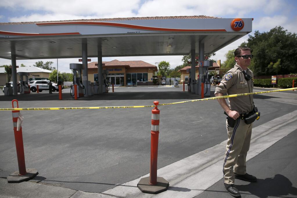 Members of the Sonoma County Sheriff's Office investigate the reported shooting of a sheriff's deputy by a employee of the Jolly Washer Car Wash/76 gas station at 19249 Hwy 12 on Sunday, May 13, 2018 in Sonoma, California . (BETH SCHLANKER/The Press Democrat)