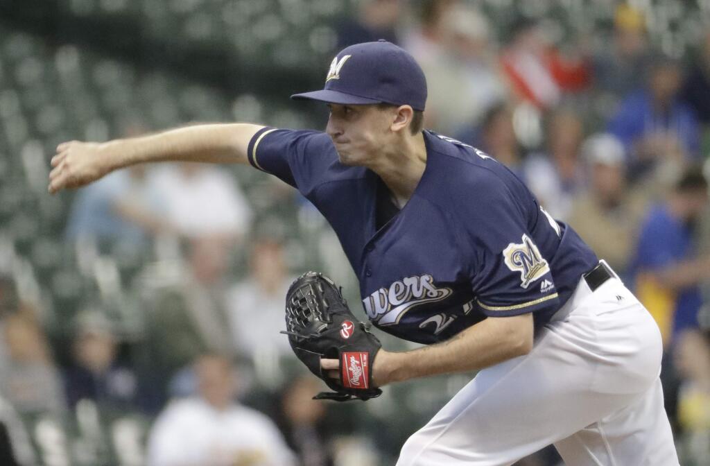 Milwaukee Brewers starting pitcher Zach Davies throws during the first inning of a baseball game against the Oakland Athletics Tuesday, June 7, 2016, in Milwaukee. (AP Photo/Morry Gash)