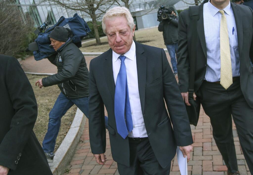 FILE - In this March 29, 2019, file photo, Robert Flaxman, founder and CEO of Crown Realty & Development, leaves the federal courthouse in Boston after a hearing in a nationwide college admissions bribery scandal. Flaxman is scheduled to be sentenced on Friday, Oct. 18. (Nicolaus Czarnecki//The Boston Herald via AP, File)