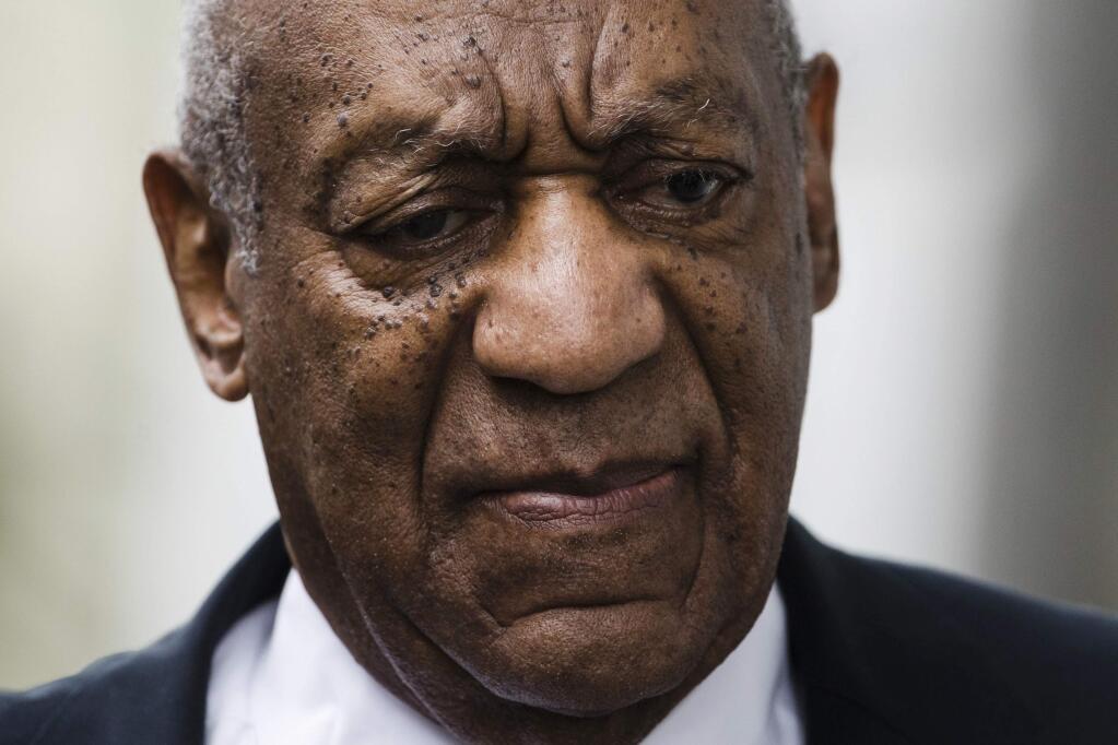 FILE - In this June 17, 2017 file photo, Bill Cosby arrives for his sexual assault trial at the Montgomery County Courthouse in Norristown, Pa. Cosby's spokesman announced Monday, Aug. 21, 2017, that Cosby has hired Michael Jackson's former lawyer, Tom Mesereau, to represent him at his November retrial on sexual assault charges in Pennsylvania.(AP Photo/Matt Rourke, File)