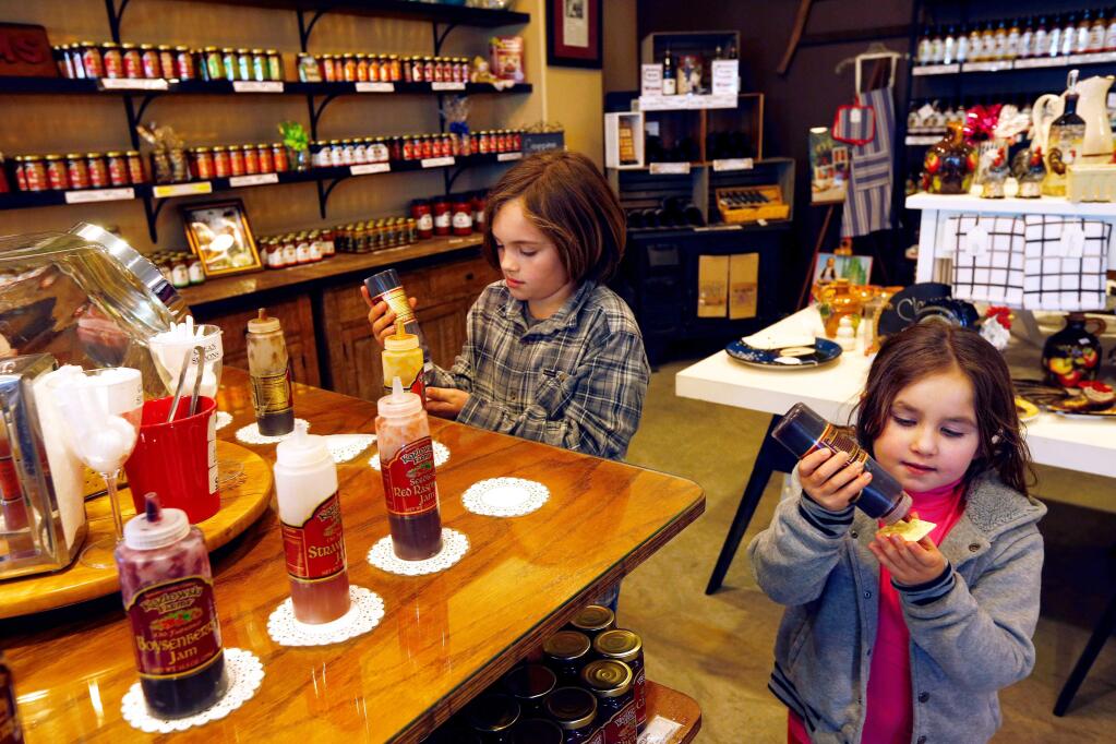 Alisia Gutierrez, 6, right, and her brother Antonio, 9, sample jams and jellies at the Kozlowski Farms store in Forestville, California on Thursday, Feb. 23, 2017. (ALVIN JORNADA/ PD)