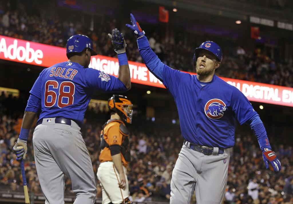 Chicago Cubs' Ben Zobrist, right, is greeted by teammate Jorge Soler after hitting a home run off San Francisco Giants relief pitcher George Kontos during the eighth inning Friday, May 20, 2016, in San Francisco. (AP Photo/Eric Risberg)