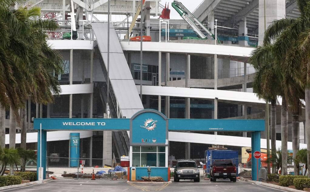 In this, Saturday, May 21, 2016, photo, the stadium where the Miami Dolphins play football is shown under renovation in Miami Gardens, Fla. The NFL awarded Super Bowls to Atlanta (2019), Miami (2020) and Los Angeles (2021), three cities that made significant financial investments in new stadiums or recently upgraded an existing one, Tuesday, May 24, 2016, at the NFL owners meetings. (AP Photo/Wilfredo Lee)