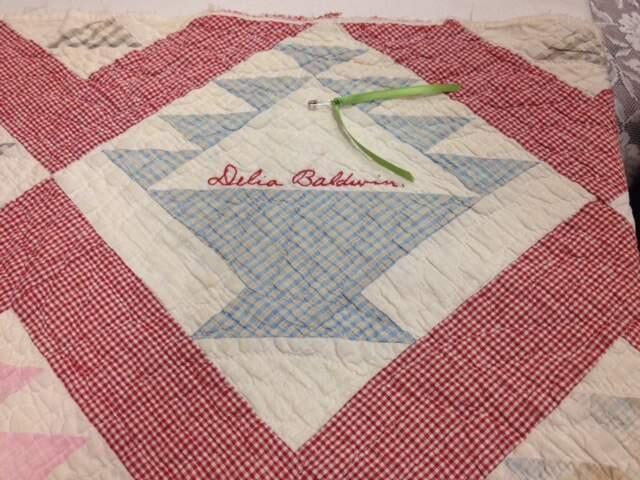 A closeup of a quilt Judy Stephens owned for years shows the names of the 33 Missouri women who made it in the 1930s. Stephens gave the quilt to the granddaughter of Delia Baldwin, one of the quilters.