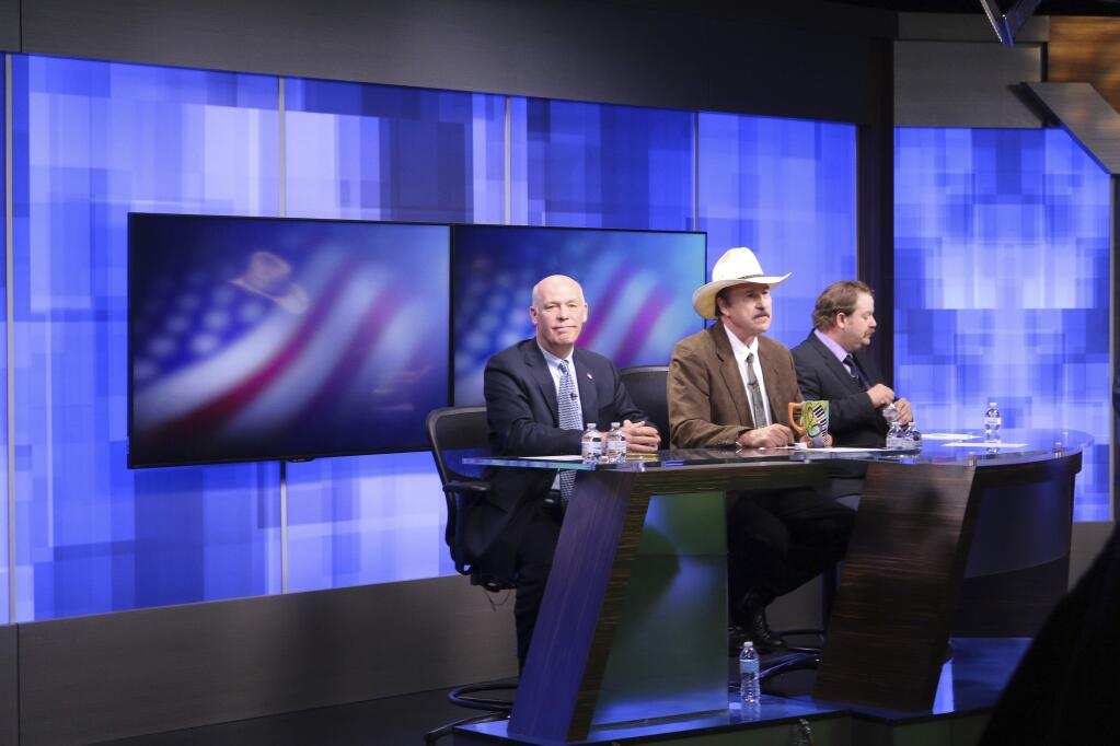 FILE - In this April 29, 2017, file photo, three candidates, from left, Republican Greg Gianforte, Democrat Rob Quist and Libertarian Mark Wicks vying to fill Montana's only congressional seat await the start of their only televised debate in Great Falls, Mont. Montana voters are heading to the polls Thursday, May 25, 2017, to decide a nationally watched congressional election amid uncertainty in Washington over President Donald Trump's agenda and his handling of the country's affairs. (AP Photo/Bobby Caina Calvan, file)