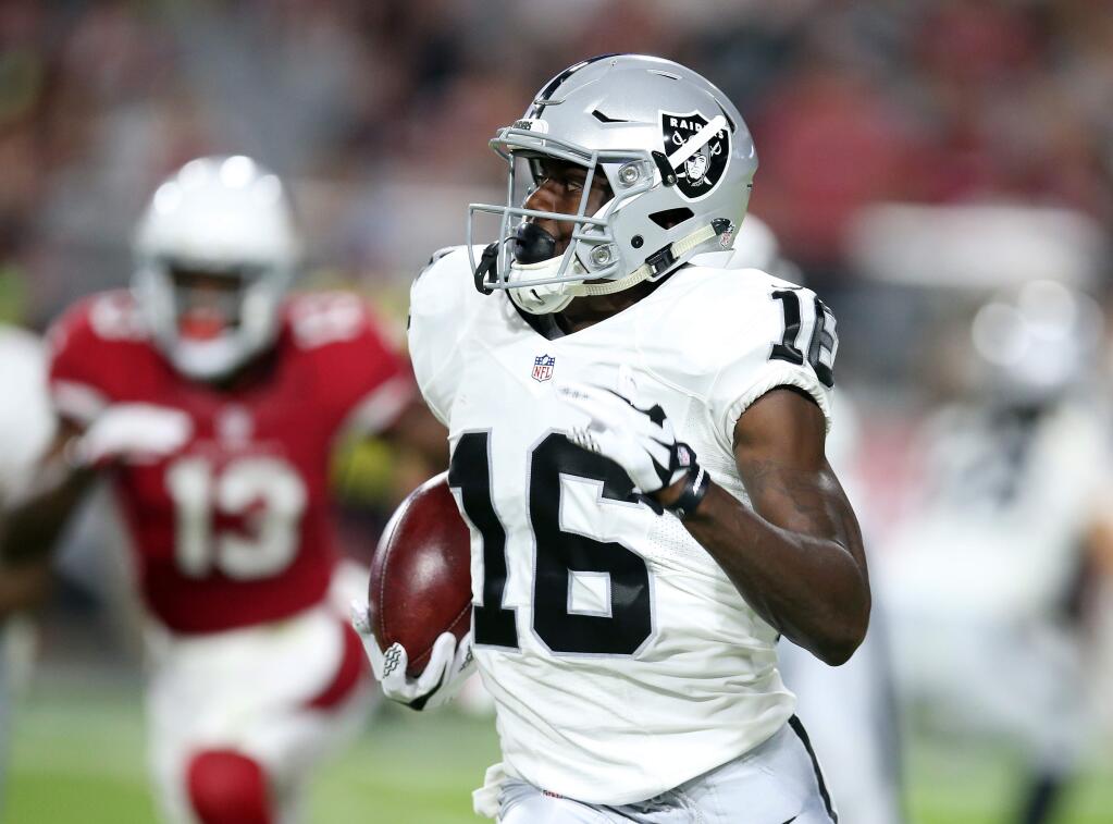 Oakland Raiders wide receiver Johnny Holton (16) returns the kick in the first half during an NFL preseason football game against the Arizona Cardinals, Friday, Aug. 12, 2016, in Glendale, Ariz. (AP Photo/Rick Scuteri)