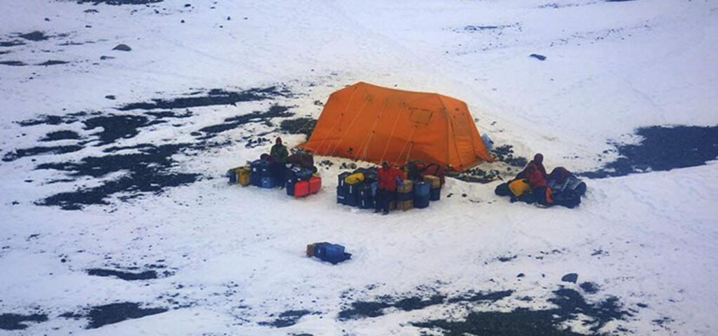 This Sunday, March 11, 2018 photo distributed by Argentina's Navy shows stranded American scientists on Joinville Island in Antarctica, south of the Argentine mainland. An Argentine icebreaker has rescued the five American scientists who were stranded in the island off the northeast tip of the Antarctic Peninsula. (Argentina Navy via AP)
