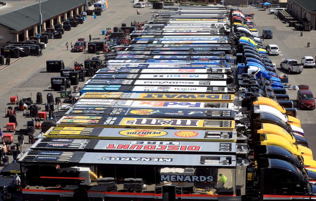 Crews unload NASCAR haulers, Thursday, June 20, 2019 at Sonoma Raceway. (Kent Porter / The Press Democrat)