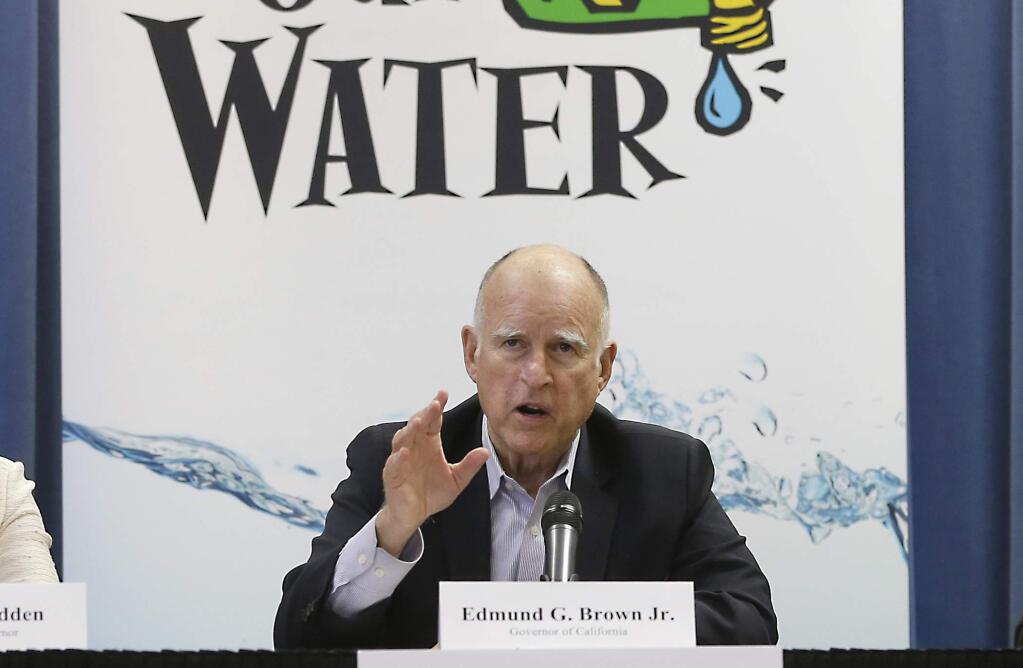 Gov. Jerry Brown responds to a question after a meeting with businesses affected by the drought at his Capitol office in Sacramento, Calif., Thursday, April 16, 2015. (AP Photo/Rich Pedroncelli)