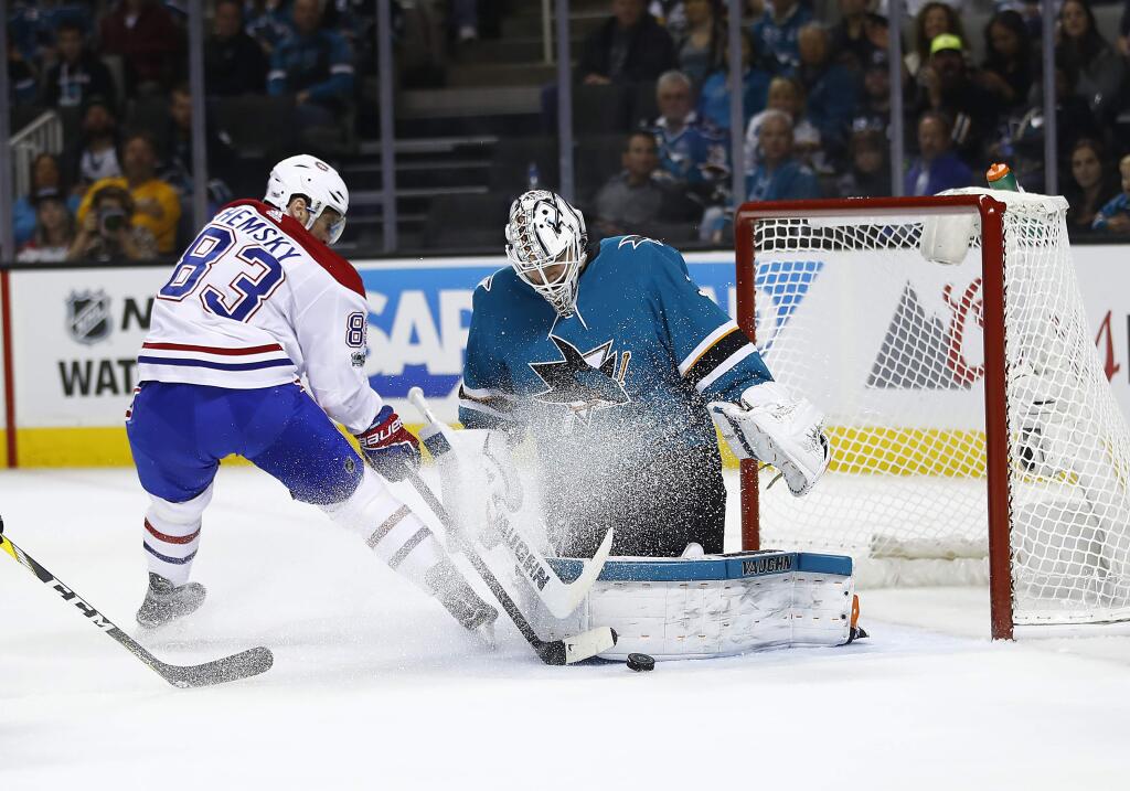 San Jose Sharks goalie Martin Jones, right, blocks a goal attempt by Montreal Canadiens right wing Ales Hemsky during the second period Tuesday, Oct. 17, 2017, in San Jose. (AP Photo/Tony Avelar)