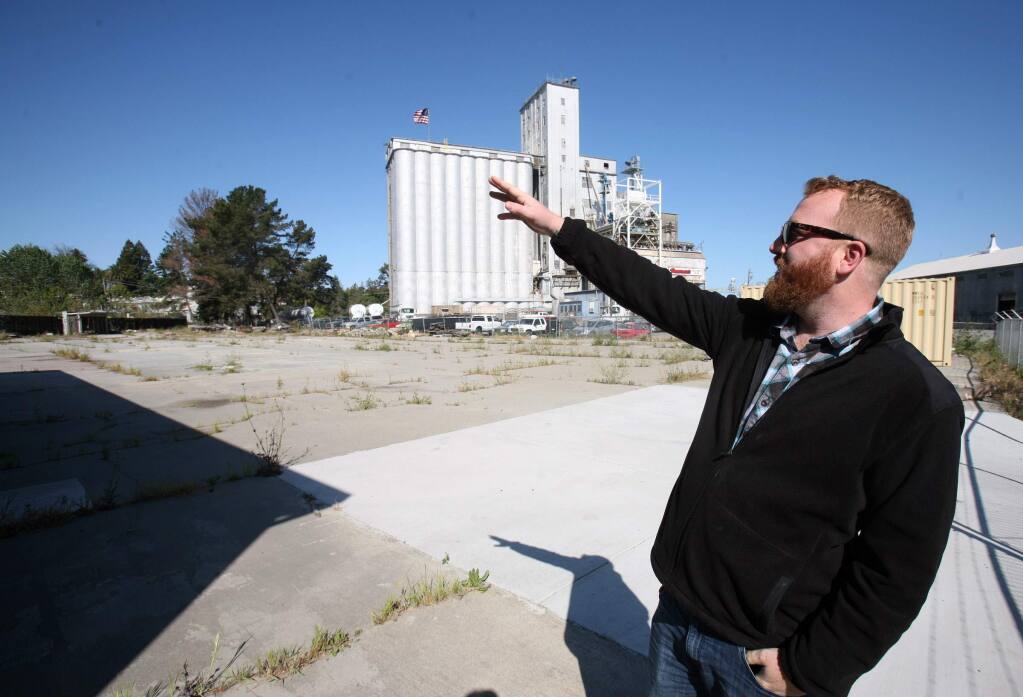 Charles Hildreath checks out the property where he plans to create a food truck outdoor eatery anchored by a beer bar and garden on Baylis Street off of East Washington St. in Petaluma on Tuesday, April 14, 2015. (SCOTT MANCHESTER/ARGUS-COURIER STAFF)