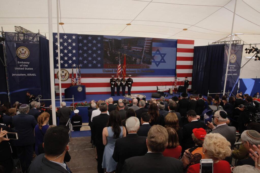 Presentation of colors by U.S Marines and singing of the U.S national anthem during the opening ceremony of the new US embassy in Jerusalem, Monday, May 14, 2018. Amid deadly clashes along the Israeli-Palestinian border, President Donald Trump's top aides and supporters on Monday celebrated the opening of the new U.S. Embassy in Jerusalem as a campaign promised fulfilled. (AP Photo/Sebastian Scheiner)