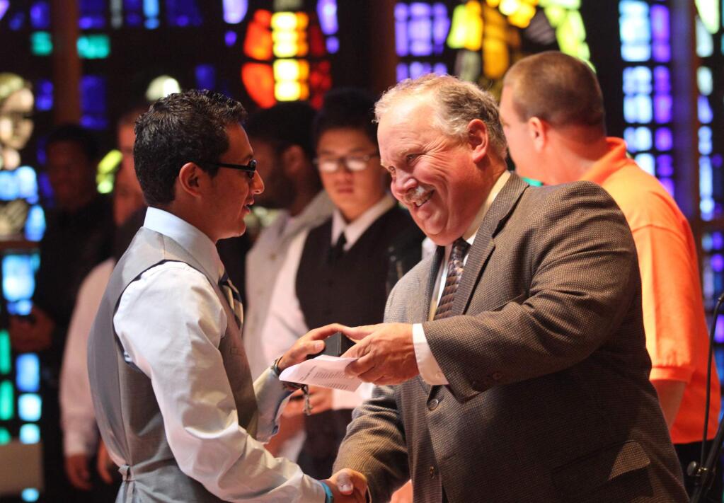 Luis Rodriguez received his senior ring from Hanna Boys Center principal Dennis Crandall during a service at Our Lady of Fatima Chapel at Hanna Boys Center. File photo.
