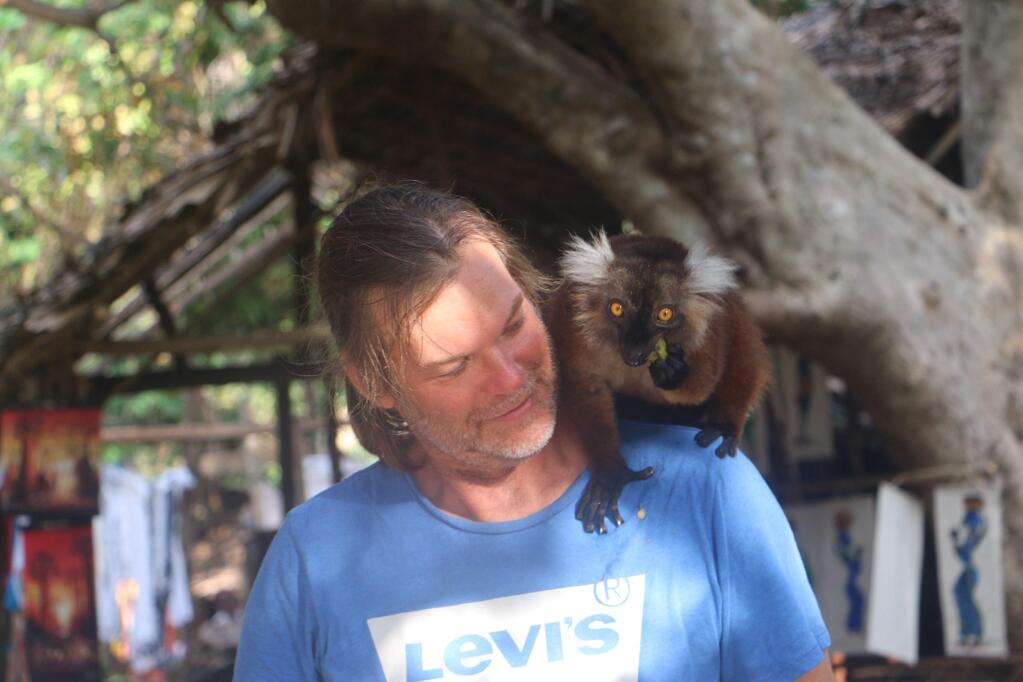 Warren Holybee with a lemur in Madagascar. WARREN HOLYBEE